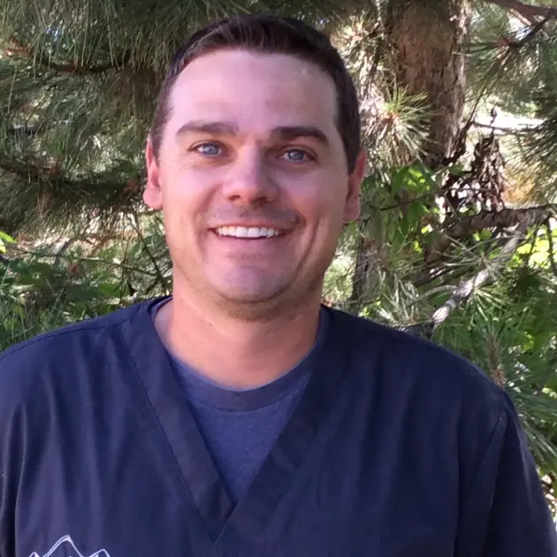 Dr. Doug Nicodemus, dentist at Cañon City dental practice, smiling outdoors.